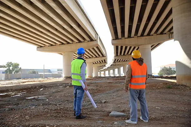 Two construction workers or engineers.