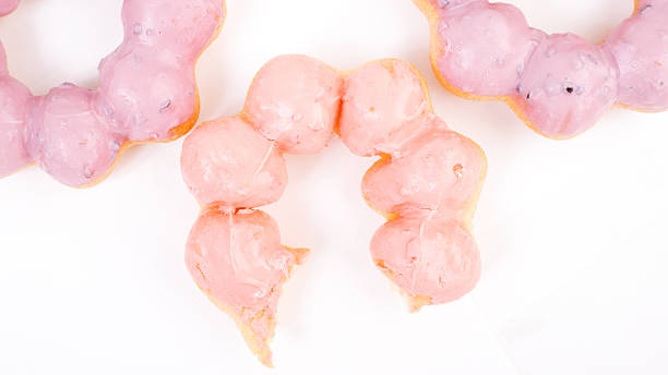 três dónute isolado num segundo plano. pastel cores - remote fat overweight dieting imagens e fotografias de stock