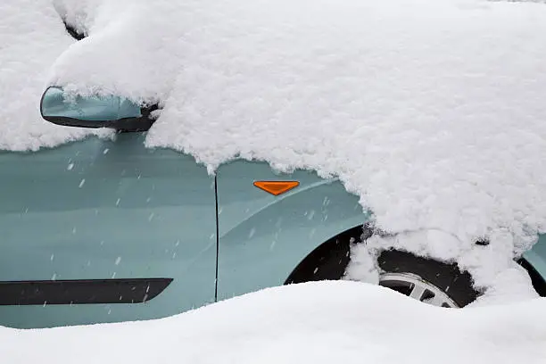 Photo of Car covered with big snow