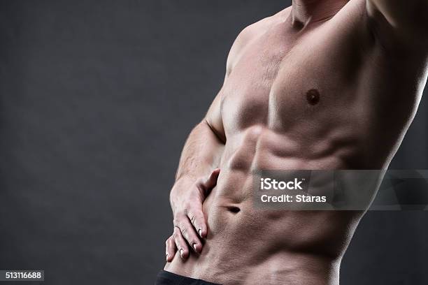 Handsome Muscular Bodybuilder Posing On Gray Background Stock Photo - Download Image Now