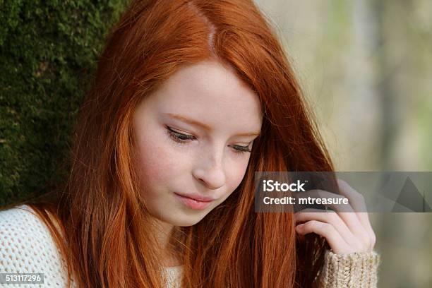 Stock Head Shot Image Of Pretty Red Haired Girl Lookingdown Stock Photo - Download Image Now
