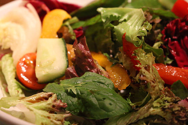 istock Image of balsamic and olive oil dressed mixed leaf salad 513117624