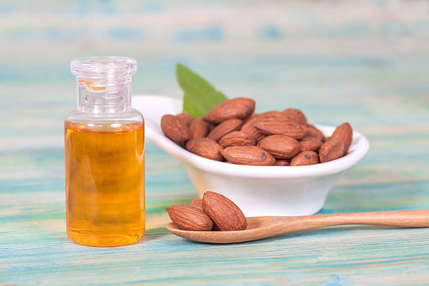 istock Almonds on wood and oil bottle 513117722