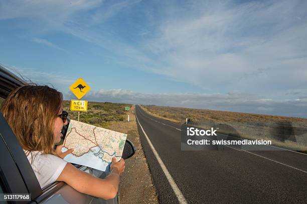 Young Woman In A Car Reads A Road Mapaustralia Stock Photo - Download Image Now - Australia, Kangaroo, Car Rental