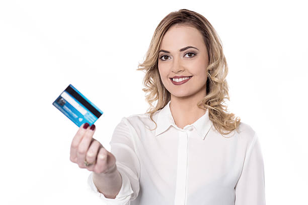 istock Pretty woman holding her card 513118272