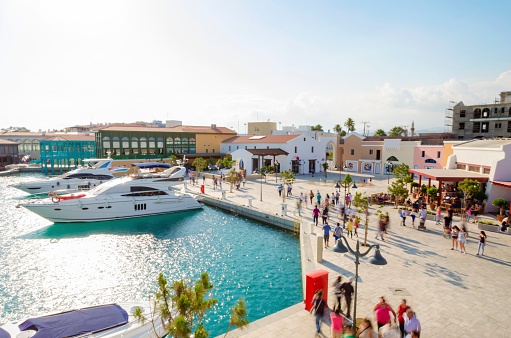 The beautiful Marina in Limassol city in Cyprus. A very modern, high end and newly developed area where yachts are moored and it's perfect for a waterfront promenade. A view of the commercial area.
