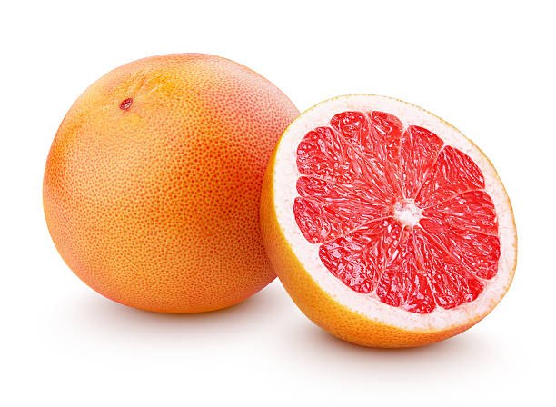 maduro toronja fruta cítrica con media aislado en blanco - vegetarian food freshness raw pink fotografías e imágenes de stock