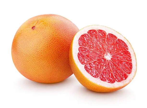 Photo of Ripe grapefruit citrus fruit with half isolated on white