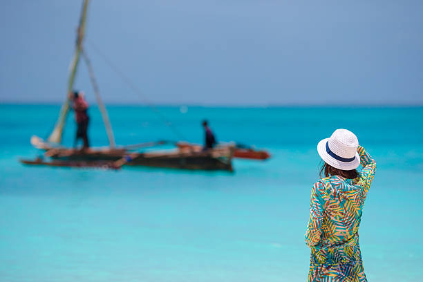 istock Young beautiful woman on beach during tropical vacation 513123312