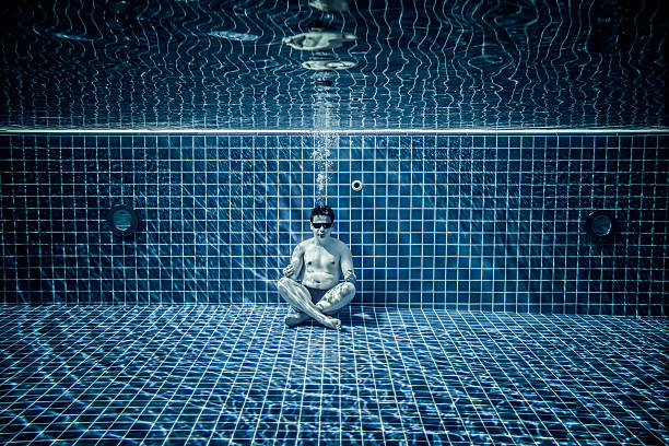 istock Persons lies under water in a swimming pool 513123488