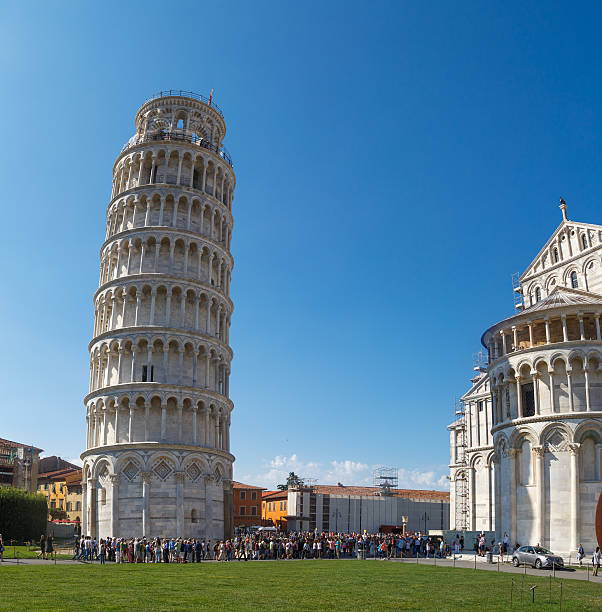 Pisa Tower View Pisa, Italy - September 21, 2015 : View of historical Pisa Tower in Cathedral Square of Pisa, Italy, on bright blue sky background. pisa leaning tower of pisa tower famous place stock pictures, royalty-free photos & images