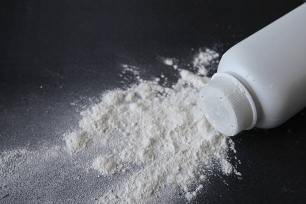 istock Talcum powder on black background 513124184