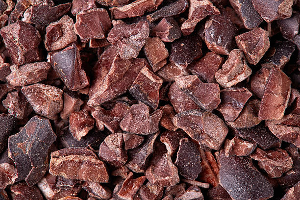 Cacao nibs Cacao nibs background, close up cacao nib stock pictures, royalty-free photos & images