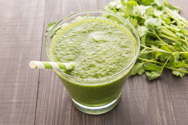 istock Healthy green vegetables smoothie on rustic wood table 513125208