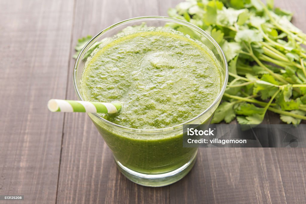 Healthy green vegetables smoothie on rustic wood table Healthy green vegetables smoothie on rustic wood table. Antioxidant Stock Photo