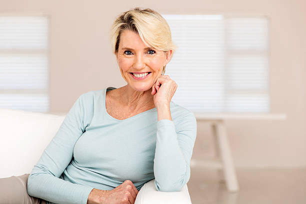 istock mid age woman relaxing at home 513126166
