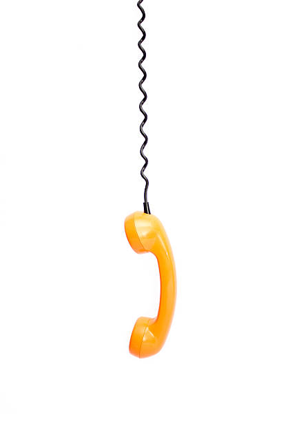 istock Orange retro telephone tube isolated on white background. 513129202