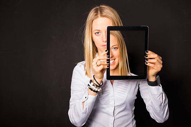 istock Woman standing with tablet in her hands 513129246