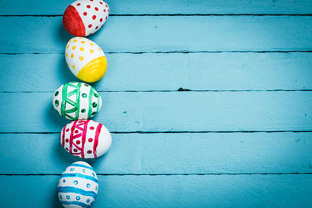 istock Easter concept with colorful eggs on wooden background 513129762