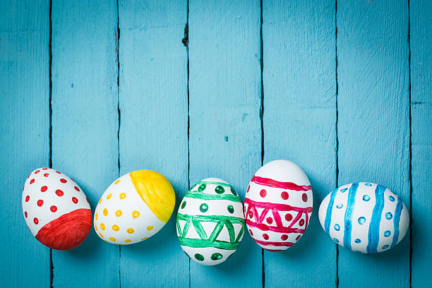istock Easter concept with colorful eggs on wooden background 513129810
