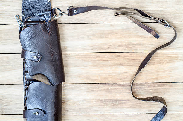 istock Old leather hunting  bandoleer on a wooden table 513130960