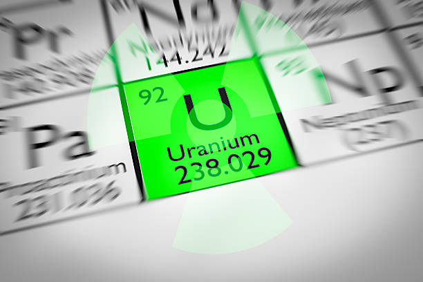 Focus on radioactive green Uranium Chemical Element stock photo