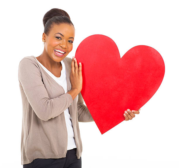 istock black woman holding red heart 513134489