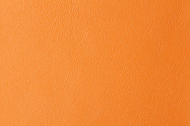 istock Background with texture of orange leather 513134581