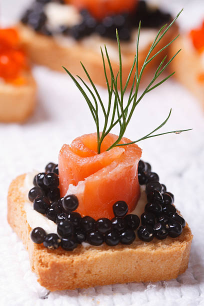 istock Canapes with black sturgeon caviar and salmon fish 513134995