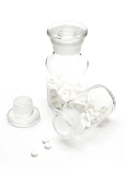 A generic pharmaceutical retro glass bottle with pills