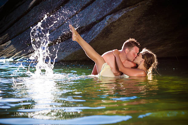 passionate kiss with splashes stock photo