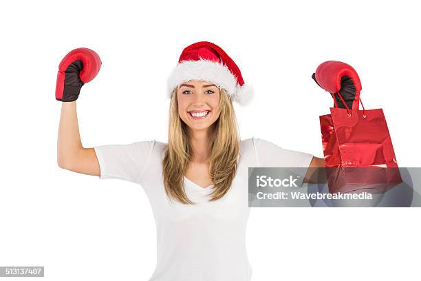 Festive Blonde Punching With Boxing Gloves Stock Photo - Download Image Now - 18-19 Years, Activity, Adult