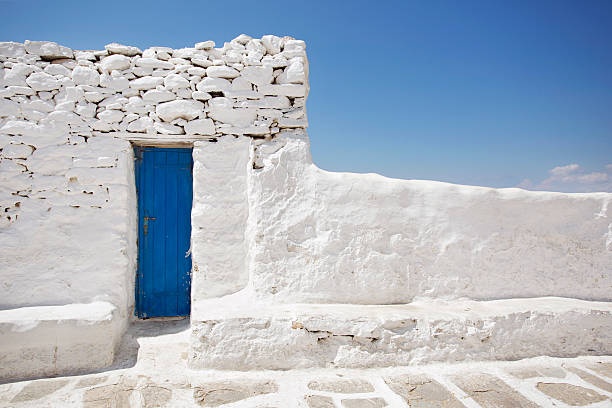 istock Blue Door and White Stone Wall 513138623