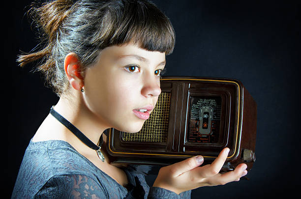 istock Girl With Old Radio 513139055