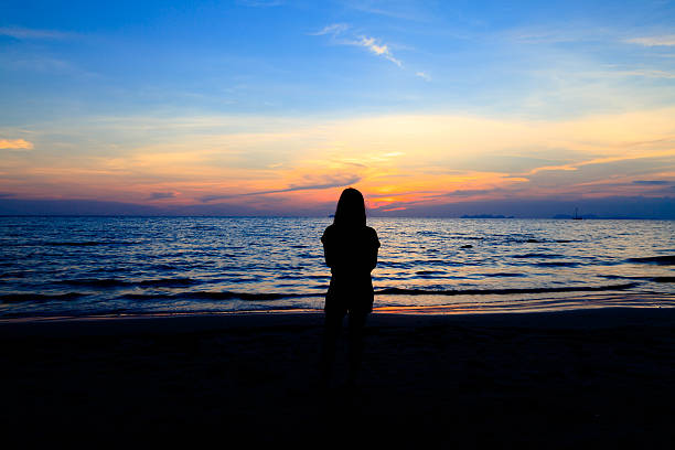 istock Asian girl on the sunset beach 513139929
