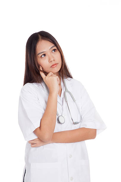 istock Asian young female doctor thinking looking up 513160079