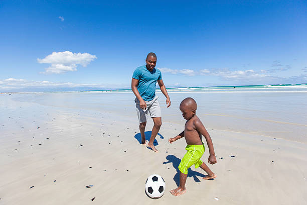 istock African father playing soccer with his son 513162279