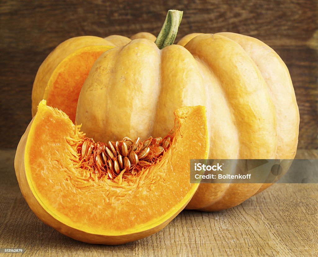 Pumpkin Pumpkin with slice on wood Autumn Stock Photo