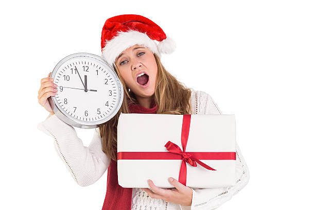istock Festive blonde showing a clock and gift 513163975