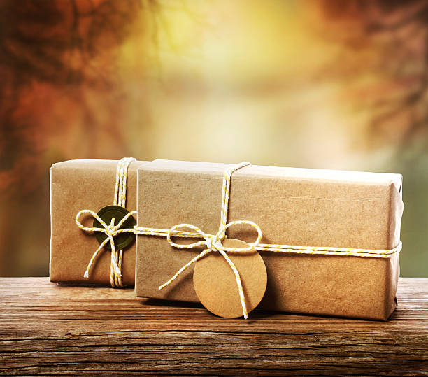 istock Handcrafted gift boxes with an autumn background 513182443