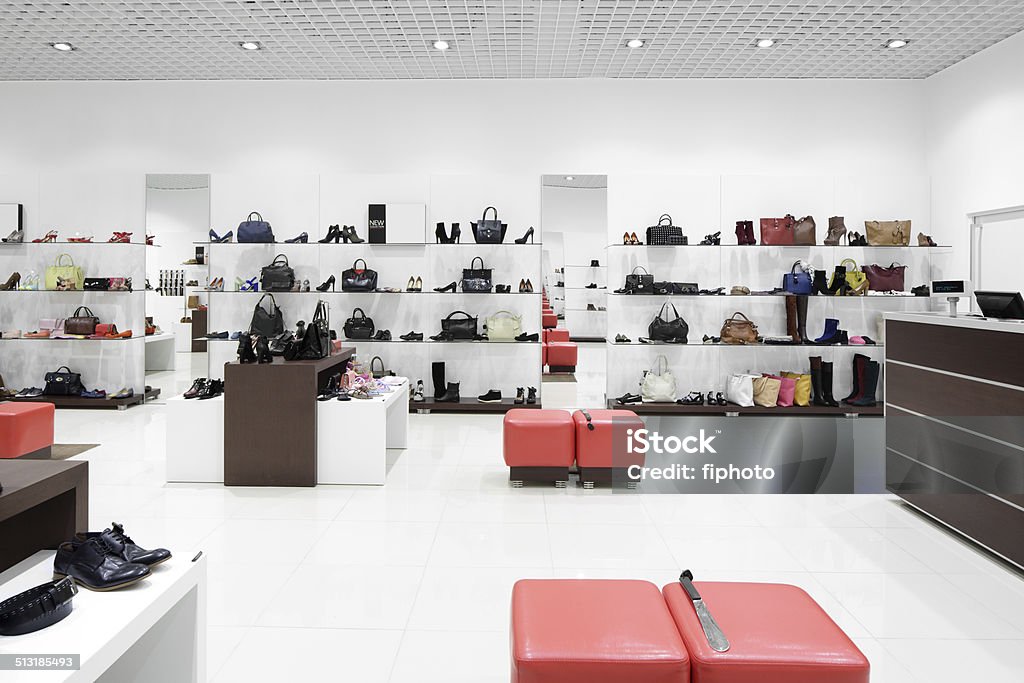 interior of shoe store in modern european mall bright and fashionable interior of shoe store in modern mall Boutique Stock Photo