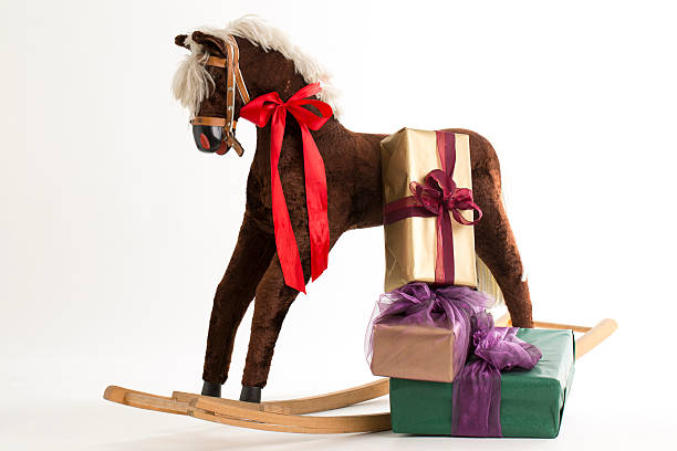 istock rocking horse and gift 513203327