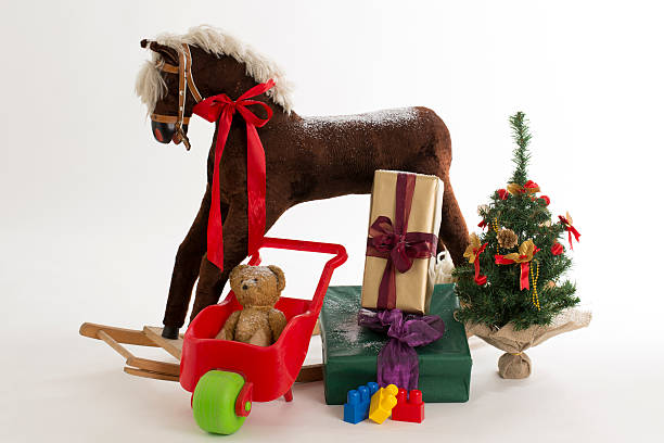 istock rocking horse and gift 513204293