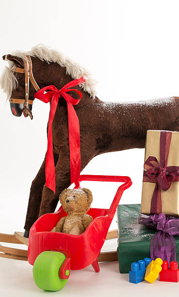 istock rocking horse and gift 513204305