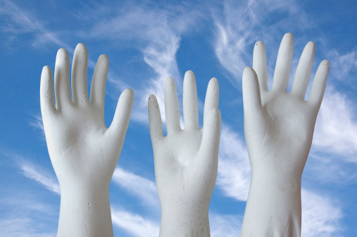 white molded plaster-of-paris hands reaching skyward