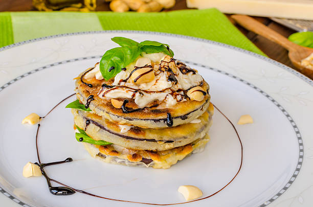 istock Grilled eggplant with feta cheese,parmesan basil, nuts 513207481