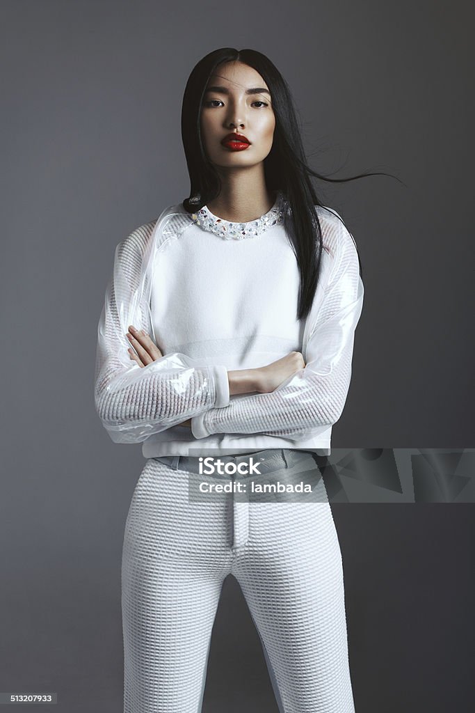 Fashionable Asian woman Beautiful asian woman wearing trendy white suit. Professional make-up and hairstyle. High-end retouch. Fashion Stock Photo