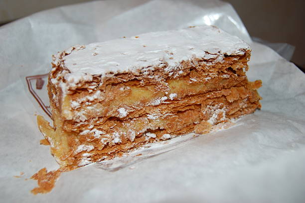Flaky neopolitan pastry with cream and sugar in Paris