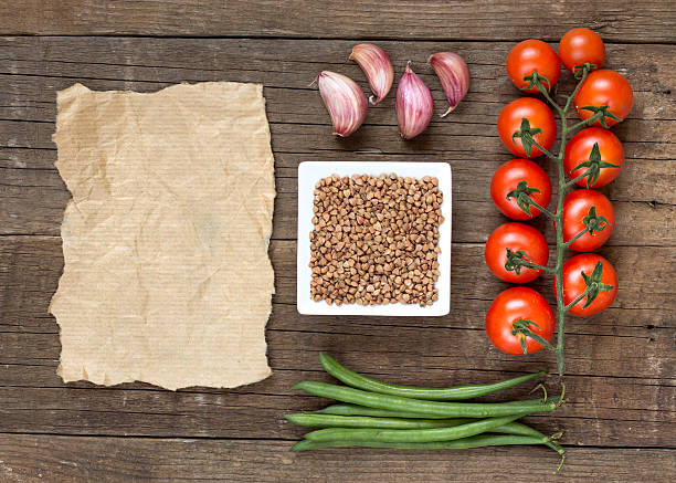 istock Raw Organic buckwheat, vegetables and paper 513209581