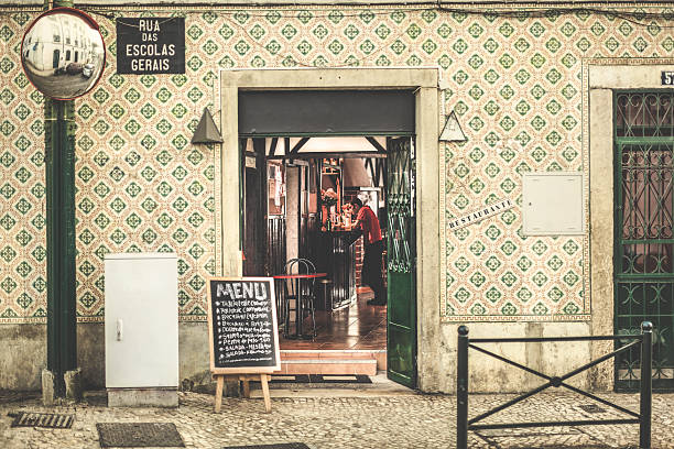Lisbon, Portugal - September 5, 2014: Waiter working in a typical portuguese restaurant in Lisbon, Alfama district 